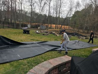 Working the pond liner